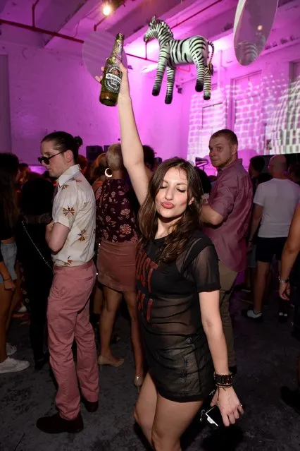 A guest enjoys Heineken at I Feel Love in celebration with Absolut at Brooklyn Sanctuary on September 9, 2016 in New York City. (Photo by Mike Pont/Getty Images for Republic Records)