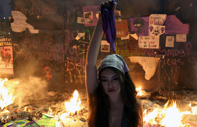 A demonstrator performs during a march to mark the International Women's Day in Mexico City, on March 8, 2024. (Photo by Silvana Flores/AFP Photo)