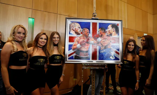 Ring girls pose with a piece of artwork after the George Groves and Chris Eubank Jr weigh in at Crowne Plaza Hotel in Manchester on February 16, 2018 in Manchester, England. (Photo by Lee Smith/Reuters/Action Images)
