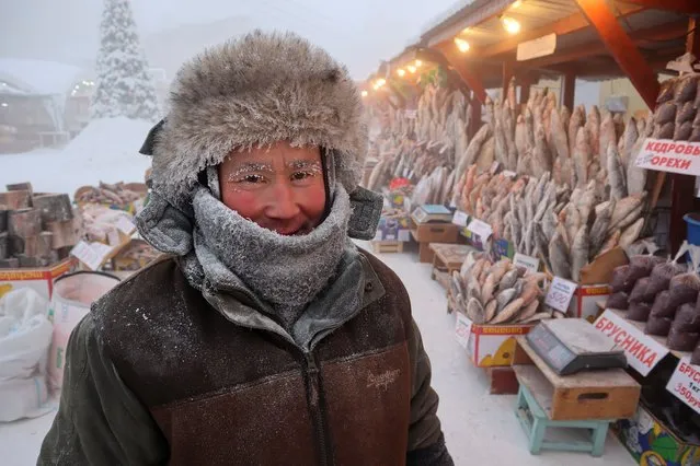 Vendor Yegor Dyachkovsky, 45, poses for a picture at an open-air market on a frosty day in Yakutsk, Russia, January 15, 2023. Yakutsk, one of the Russia's north-most cities, is hit by an extreme cold snap as the air temperature on Sunday (January 15) plunged as low as minus 51 degrees Celsius (minus 59.8 degrees Fahrenheit). (Photo by Roman Kutukov/Reuters)