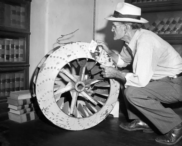 In this Sept. 22, 1955 file photo, a cotton-gin fan is presented as evidence in the trial investigating the death of 14-year-old Emmett Louis Till, in Sumner, Miss., on September 22, 1955. The fan had been tied around the boy's neck with barbed wire when his body was found in the Tallahatchie River near the Delta community of Money, Mississippi, on August 31, 1955. The case is one of nearly one hundred unsolved racial killings that has been prosecuted under the FBI's Cold Case Initiative. Hopes were raised, say family members of the victims, but justice has not followed. (Photo by AP Photo)
