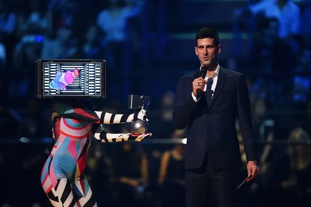 Tennis pro Novak Djokovic presents best Hip-Hop award on stage during the MTV EMA's 2015 at the Mediolanum Forum on October 25, 2015 in Milan, Italy. (Photo by Brian Rasic/Getty Images for MTV)