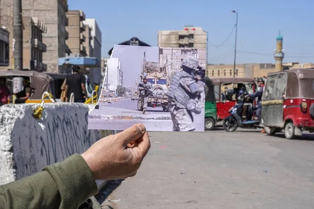 A photograph of U.S. troops taking positions during a gunfight with militants in the dominantly Sunni neighborhood of Fadhil in Baghdad, Iraq, Sunday, March 29, 2009, iis inserted into the scene at the same location on Friday, March 10, 2023, 20 years after the U.S. led invasion on Iraq and subsequent war. (Photo by Hadi Mizban/AP Photo)