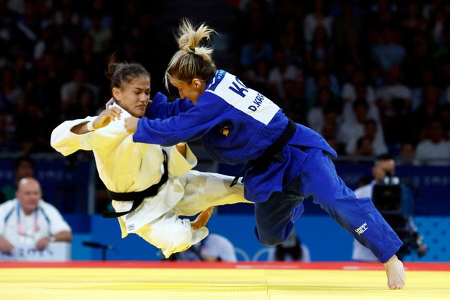Uzbekistan's Diyora Keldiyorova and Kosovo's Distria Krasniqi (Blue) compete in the judo women's -52kg gold medal bout of the Paris 2024 Olympic Games at the Champ-de-Mars Arena, in Paris on July 28, 2024. (Photo by Kim Kyung-Hoon/Reuters)