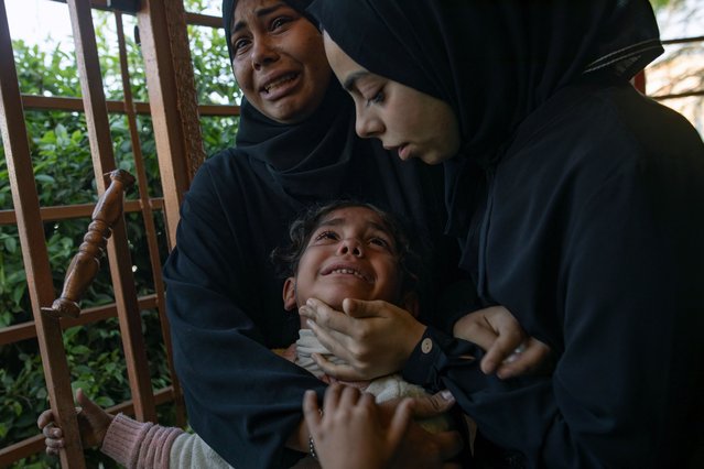 Palestinians mourn beside the bodies of their relatives at Nasser Hospital in Khan Yunis, southern Gaza Strip, 20 November 2025. The Palestinian Ministry of Health in Gaza reported at least 24 Palestinians were killed following Israeli airstrikes in the north and south of the Gaza Strip. (Photo by Haitham Imad/EPA)