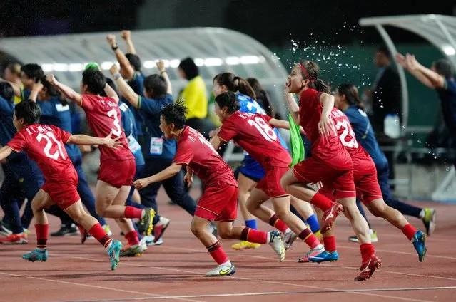 Vietnam's players celebrate after winning against Myanmar in the women's football final at National Olympic Stadium in Phnom Penh, Cambodia on May 15, 2023. (Photo by Cindy Liu/Reuters)