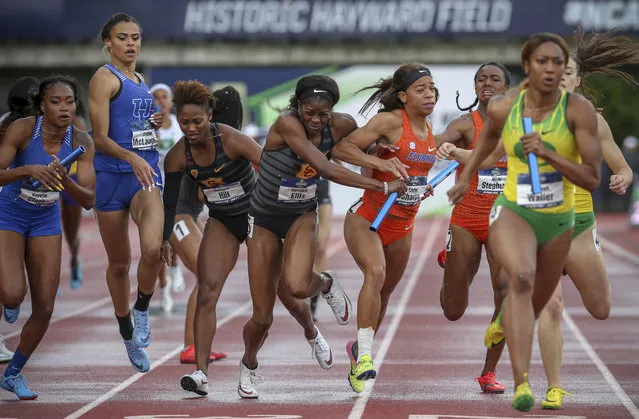 Southern California's Kendall Ellis, center left, and Florida's Taylor Sharpe collide on the anchor lap of the women's 1,600 relay on the final day of the NCAA Outdoor Track and Field Championships at Hayward Field on Saturday, June 9, 2018, in Eugene, Ore. Southern California won the race. (Photo by Collin Andrew/The Register-Guard via AP Photo)