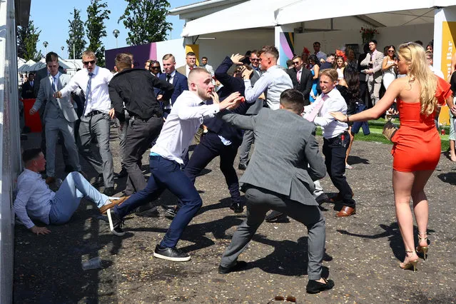 Racegoers clash at the Epsom Derby Festival in Epsom, Britain on June 2, 2023. (Photo by Matthew Childs/Action Images via Reuters)