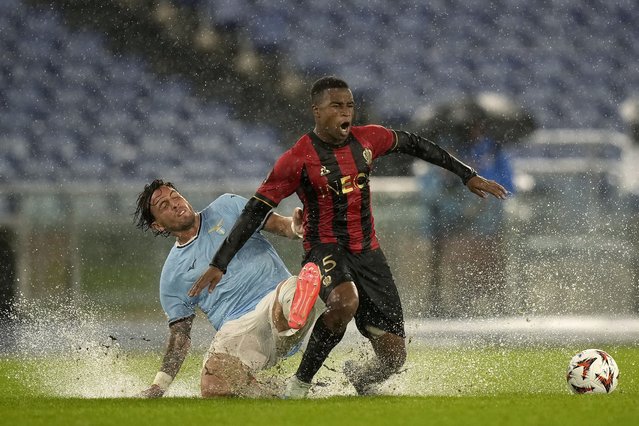 Lazio's Luca Pellegrini, left, and Nice's Youssoufa Moukoko fight for the ball during an Europa League opening phase soccer match between Lazio and Nice, at Rome's Olympic Stadium, Thursday, October 3, 2024. (Photo by Andrew Medichini/AP Photo)