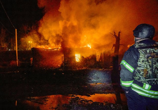 Ukrainian rescuers work at the site of a Russian strike on a residential area in Kharkiv, northeastern Ukraine, 24 November 2025, amid the Russian invasion. At least four people were killed and dozens injured, including two children, after overnight Russian strikes in Kharkiv, the head of the Kharkiv Military Administration, Oleg Synegubov, reported. (Photo by Sergey Kozlov/EPA)