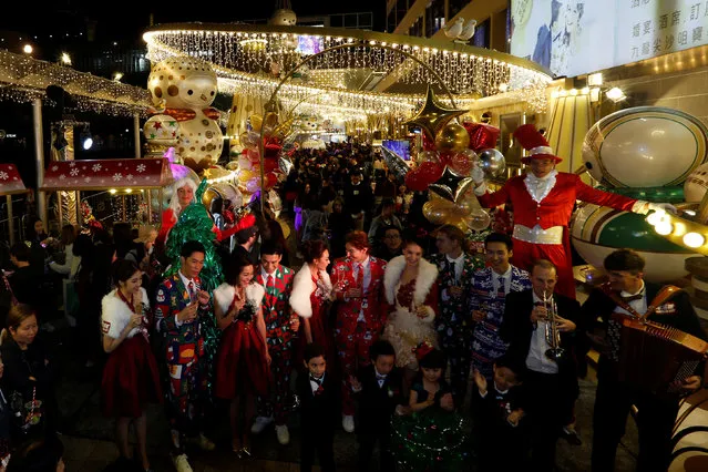Models pose outside Harbour City shopping mall during a Christmas lights illuminating ceremony in Hong Kong, China November 10, 2016. (Photo by Bobby Yip/Reuters)