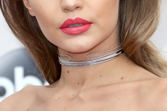 Model Gigi Hadid, jewelry detail, attends the 2016 American Music Awards at Microsoft Theater on November 20, 2016 in Los Angeles, California. (Photo by Frederick M. Brown/Getty Images)