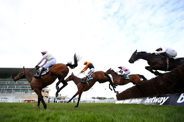 Chacun Pour Soi ridden by Paul Townend (L) and Put The Kettle On ridden by Aidan Coleman in action during the 3.05 Betway Queen Mother Champion Chase on Day Two of the Cheltenham Festival at Cheltenham Racecourse, in Cheltenham, England on March 17, 2021. (Photo by Michael Steele/Pool via Reuters)