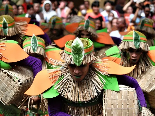 Filipino teens, wearing traditional costumes made from dried water hyacinth stalks, perform during the Water Lily Festival in Las Pinas city, Metro Manila, Philippines, 21 July 2023. The Water Lily festival aims to promote the water hyacinth-based livelihood enterprises for residents in flood prone communities of Las Pinas city and adjacent cities. (Photo by Francis R Malasig/EPA/EFE)