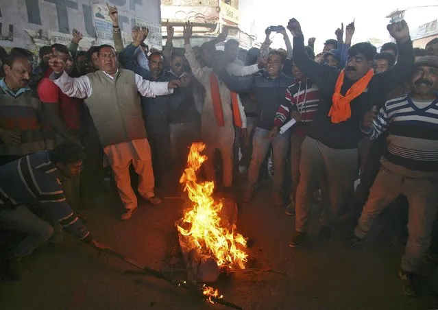 Supporters of Shiv Sena, a Hindu hardline group, shout slogans as they burn an effigy depicting Pakistan's Prime Minister Nawaz Sharif during a protest near the Indian Air Force (IAF) base at Pathankot in Punjab, India, January 3, 2016. (Photo by Mukesh Gupta/Reuters)