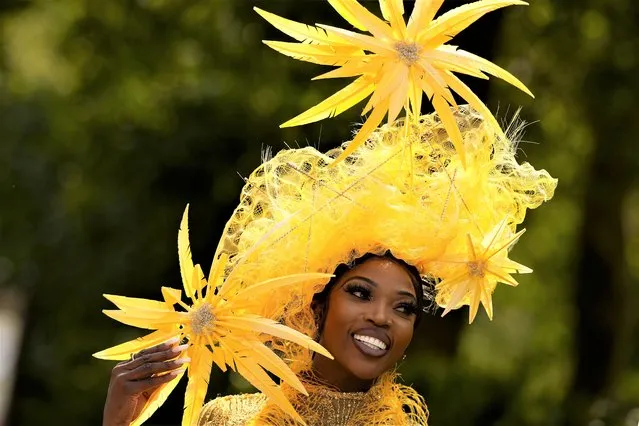 Racegoer Lystra Adam poses for photographers during Ladies Day of the Royal Ascot horse racing meeting, at Ascot Racecourse in Ascot, England, Thursday, June 22, 2023. (Photo by Alastair Grant/AP Photo)
