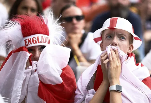 England fans react as Spain score a goal during the FIFA Women's World Cup Final between England and Spain at Manchester Piccadilly Gardens during the FIFA Women's World Cup final between England and Spain on August 20, 2023 in Manchester, England. (Photo by Jason Cairnduff/Action Images via Reuters)