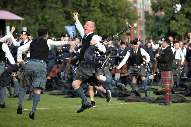 The Boghall and Bathgate Caledonia Pipe Band celebrates winning the World Pipe Band Championships in Glasgow Green, on August 19, 2023, in Glasgow, Scotland. (Photo by Alan Harvey/SNS Group)