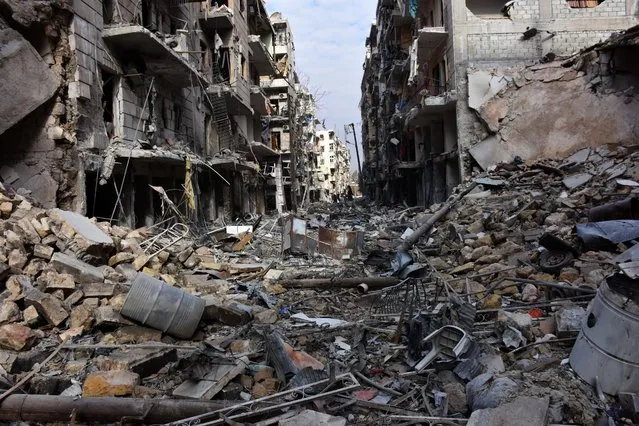 A general view shows destruction in the al- Shaar neighbourhood after government forces took control of the area in the eastern part of the northern city of Aleppo on December 7, 2016. (Photo by George Ourfalian/AFP Photo)