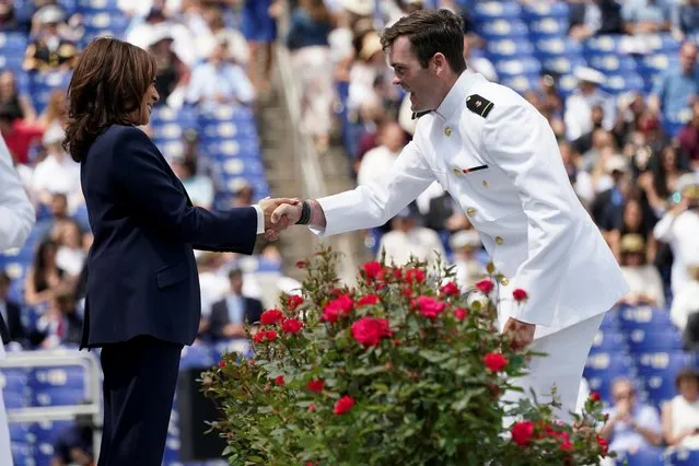 Vice President Kamala Harris shakes hands with a graduate as she attends the graduation and commissioning ceremony for the U.S. Naval Academy's Class of 2021, at the U.S. Naval Academy in Annapolis, Maryland, May 28, 2021. (Photo by Kevin Lamarque/Reuters)