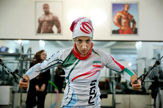 In this Monday, January 18, 2016 photo, Iranian rock climber, Farnaz Esmaeilzadeh, warms up in a gym ahead of rock climbing training session in the city of Zanjan, some 330 kilometers (207 miles) west of the capital Tehran, Iran. (Photo by Ebrahim Noroozi/AP Photo)