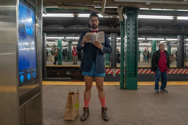 A man stands on the platform of the West 4th, F subway line during the 18th annual No Pants Subway Ride on January 13, 2019 in New York City. 24 cities participate in the annual event arranged by Improv Everywhere, a New York city based comedy collective. (Photo by David “Dee” Delgado/Getty Images)