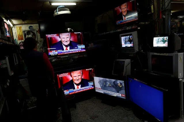 Images of U.S. President Donald Trump are seen on TV screens at a second hand shop in Taipei,Taiwan January 21, 2017. (Photo by Tyrone Siu/Reuters)