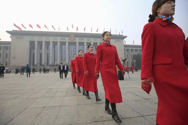 Hostesses walk outside the Great Hall of the People during the opening session of the Chinese People's Political Consultative Conference (CPPCC) in Beijing, China, March 3, 2016. (Photo by Aly Song/Reuters)