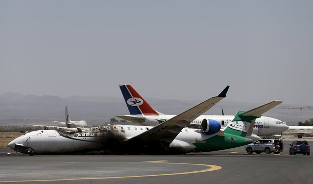 A Felix Airways plane is seen after it was destroyed by an air strike at the international airport of Yemen's capital Sanaa, April 29, 2015. (Photo by Khaled Abdullah/Reuters)