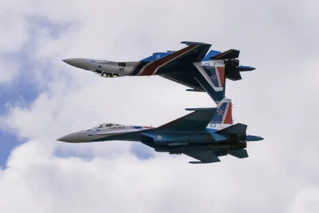 Sukhoi Su-35S jet fighters of the Russkiye Vityazi (Russian Knights) aerobatic team perform during the MAKS 2021 air show in Zhukovsky, outside Moscow, Russia, July 25, 2021. (Photo by Tatyana Makeyeva/Reuters)