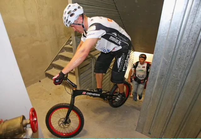 Krystian Herba, a Polish extreme cyclist jumps up the steps of Eureka Tower on a bicycle as he breaks a Guinness World Record at Eureka Tower on February 4, 2014 in Melbourne, Australia. Herba jumped up 2,919 steps on his bicycle in 1 hour 45 minutes without supporting himself with his hands or feet to break his own Guinness World Record. (Photo by Scott Barbour/Getty Images)