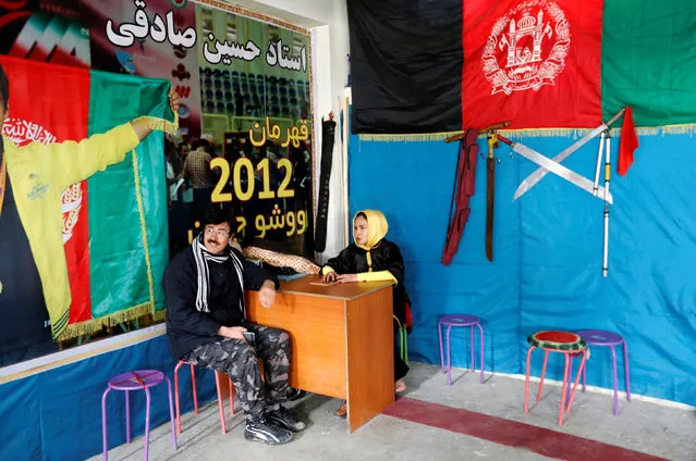 Sima Azimi (R), 20, a trainer at the Shaolin Wushu club, talks with her father Rahmatullah Azimi, 47, in Kabul, Afghanistan January 29, 2017. (Photo by Mohammad Ismail/Reuters)