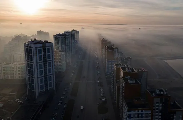 A general view shows Yekaterinburg city blanketed by smog from peat fire, Russia October 15, 2021. Picture taken with a drone. (Photo by Alexei Kolchin/Reuters)