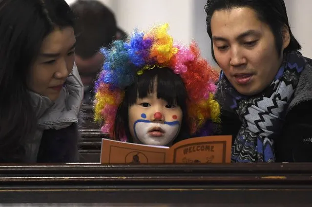 A young congregation member dresses up to attend an annual service of remembrance in honour of British clown Joseph Grimaldi at All Saints Church in Haggerston in London, Britain, February 5, 2017. (Photo by Toby Melville/Reuters)