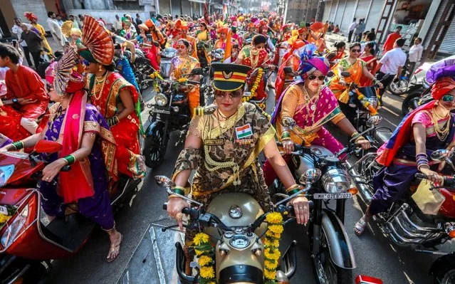 Indian people in traditional clothes take part in the procession to celebrate the Gudi Padwa, Maharashtrian's New Year in Mumbai, India, 06 April 2019. Gudi Padwa is the Hindu festival that falls on the first day of Chaitra month and marks the beginning of the Lunar Calendar, which dictates the dates for all Hindu festivals, also known as Panchang. (Photo by Divyakant Solanki/EPA/EFE/Rex Features/Shutterstock)