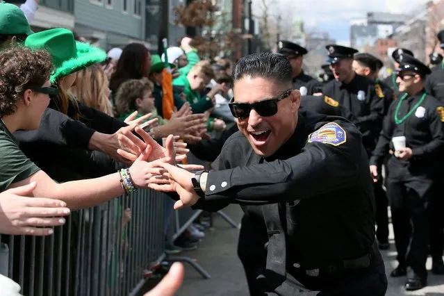 Parade participants celebrate and march during the St. Patrick’s Day Parade in the South Boston neighborhood, in Boston, Massachusetts on March 17, 2024. (Photo by Lauren Owens Lambert/Reuters)