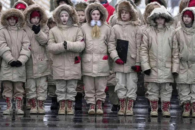 Members of the Russian Young Army Cadets National Movement stay in formation as they mark the 80th anniversary of the Battle of Moscow, in the Patriot Park outside Moscow, Russia, Sunday, December 5, 2021. The Battle of Moscow is the counterattack of Soviet troops against German invaders during World War II that didn't allow Hitler to capture the city in 1941. (Photo by Pavel Golovkin/AP Photo)