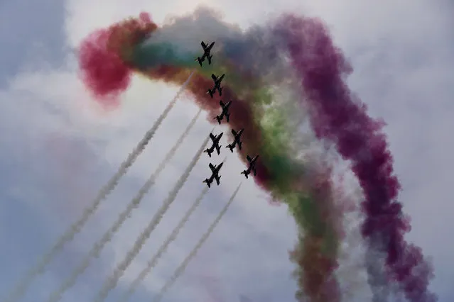 Military stunt pilots fly in formation during an exercise in Abu Dhabi, United Arab Emirates, Thursday, March 2, 2017. Abu Dhabi, the capital of the United Arab Emirates, hosted a major military exercise Thursday before a public audience as the nation fights alongside Saudi troops in Yemen and tensions with Iran remain high. (Photo by Jon Gambrell/AP Photo)