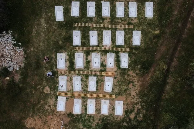 A drone view shows the renovated burial ground for refugees and migrants during its inauguration in the village of Kato Tritos, on the island of Lesbos, Greece, on April 17, 2024. (Photo by Elias Marcou/Reuters)
