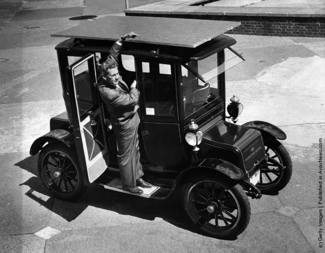 1960: The sun powered car, a 1912 Baker Electric Mode which has been adapted to run from energy obtained from the sun's rays. Dr. Charles Alexander  Escoffery, the car's inventor, explains the workings of the solar panel