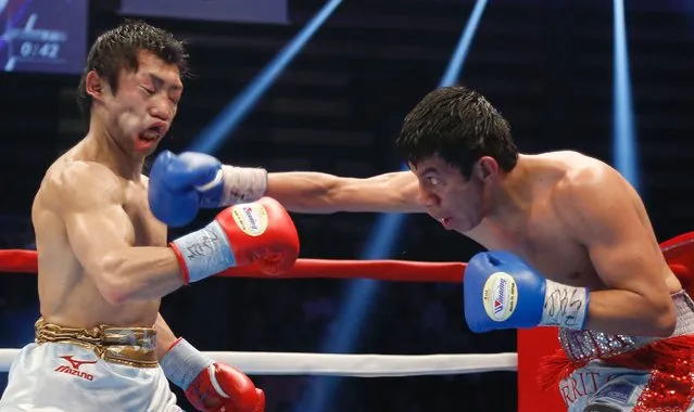 Odilon Zaleta of Mexico, right, hits a right to Akira Yaegashi of Japan during their WBC flyweight title bout in Tokyo, April 6, 2014. (Photo by Shizuo Kambayashi/AP Photo)
