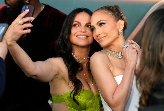 Jennifer Lopez, right, a cast member in “Atlas”" poses for a photo with fellow cast member Lana Parrilla at the premiere of the Netflix film at the Egyptian Theatre, Monday, May 20, 2024, in Los Angeles. (Photo by Chris Pizzello/AP Photo)