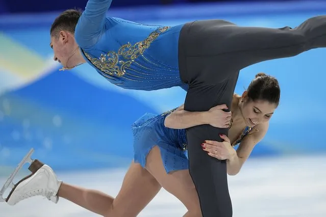 Anastasia Mishina and Aleksandr Galliamov, of the Russian Olympic Committee, compete in the pairs team free skate program during the figure skating competition at the 2022 Winter Olympics, Monday, February 7, 2022, in Beijing. (Photo by David J. Phillip/AP Photo)