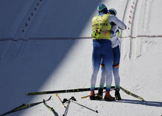 Linn Kazmaier of Germany with her guide Florian Baumann of Germany after the Para Cross-Country Skiing, Women's Long Distance Classical Technique Vision Impaired in Zhangjiakou, China on March 7, 2022. (Photo by Issei Kato/Reuters)