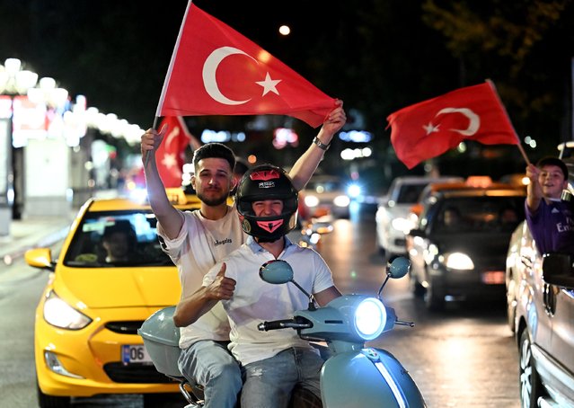 Turkish fans celebrate after their team qualified for last 16 stages following victory with car convoys in the UEFA EURO 2024 group stage match between Czechia and Turkiye on June 26, 2024 in Ankara, Turkiye. (Photo by Rasit Aydogan/Anadolu via Getty Images)