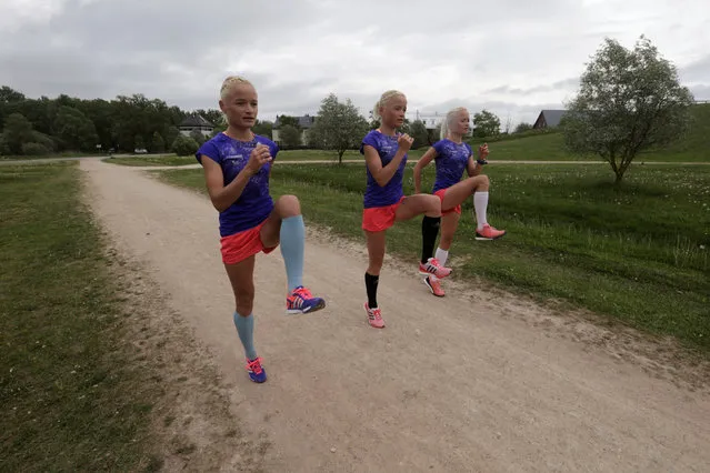 Estonia's olympic team female marathon runners triplets (L-R) Leila, Liina and Lily Luik take part in a training session in Tartu, Estonia, May 26, 2016. (Photo by Ints Kalnins/Reuters)