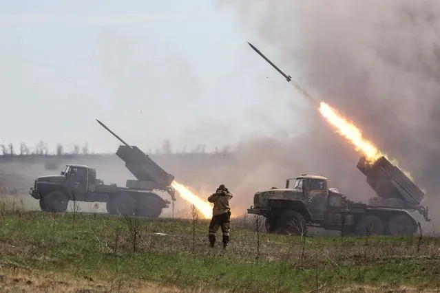 Grad multiple rocket launchers of a rocket artillery platoon of the Donetsk People's Republic people's militia firing at positions of the Ukrainian Armed Forces on the frontline in Donetsk Region, Ukraine on April 11, 2022. The Russian Armed Forces are carrying out a special military operation in Ukraine in response to requests from the leaders of the Donetsk People's Republic and Lugansk People's Republic for assistance. (Photo by Sergei Bobylev/TASS)