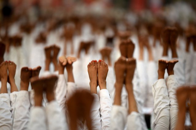 Participants perform yoga during the rehearsals for the upcoming International Yoga Day at Rajpath, June 19, 2016, in New Delhi, India. International Yoga Day is celebrated annually on June 21 and was declared to be internationally recognized by the United Nations General Assembly (UNGA) on December 11, 2014. (Photo by Virendra Singh Gosain/Getty Images/Hindustan Times)