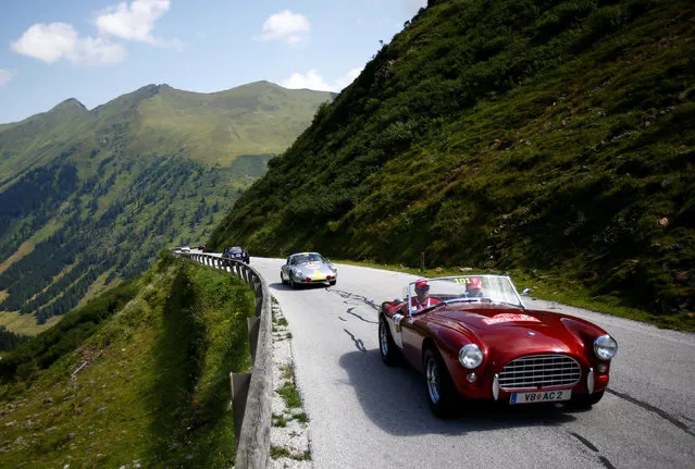 Participants drive their cars during the Ennstal Classic oldtimer rally on the road to Soelkpass, Austria on July 20, 2017. (Photo by Leonhard Foeger/Reuters)