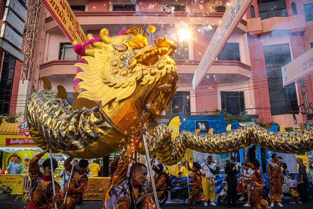 Dancers perform a Dragon dance during the vegetarian festival celebration at Yaowarat the Chinatown in Bangkok on October 8, 2024. The annaul vegetarian festival in Thailand runs from October 3 to October 12, 2024 and worshippers refrain from eating animal products over the nine days and this coincides with the celebration of the nine Chinese Emperor Gods. (Photo by Peerapon Boonyakiat/SOPA Images/Rex Features/Shutterstock)